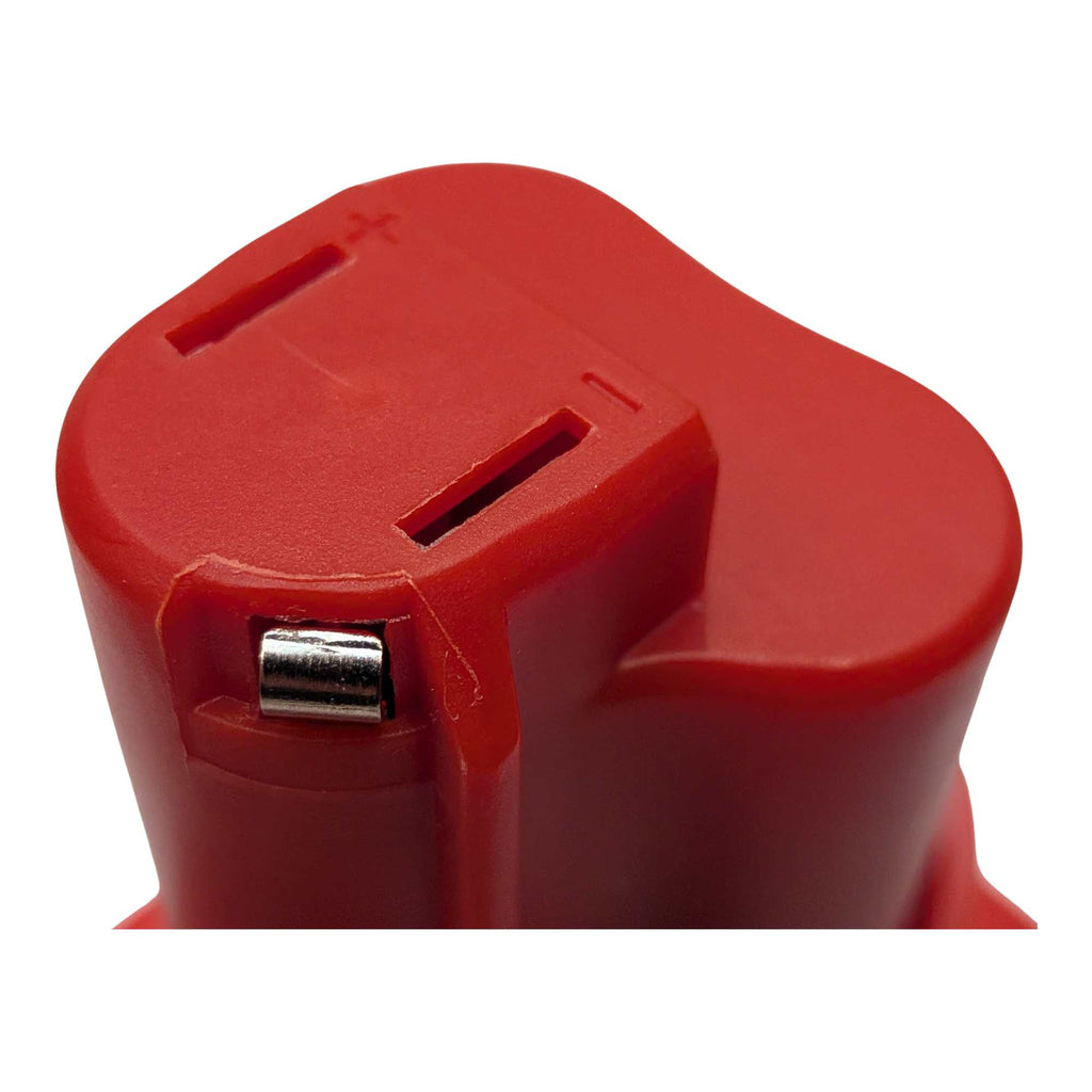 Bauer 20V to Milwaukee M12 battery adapter - close-up of the Milwaukee tool-side stem top, terminal slots and latch pin