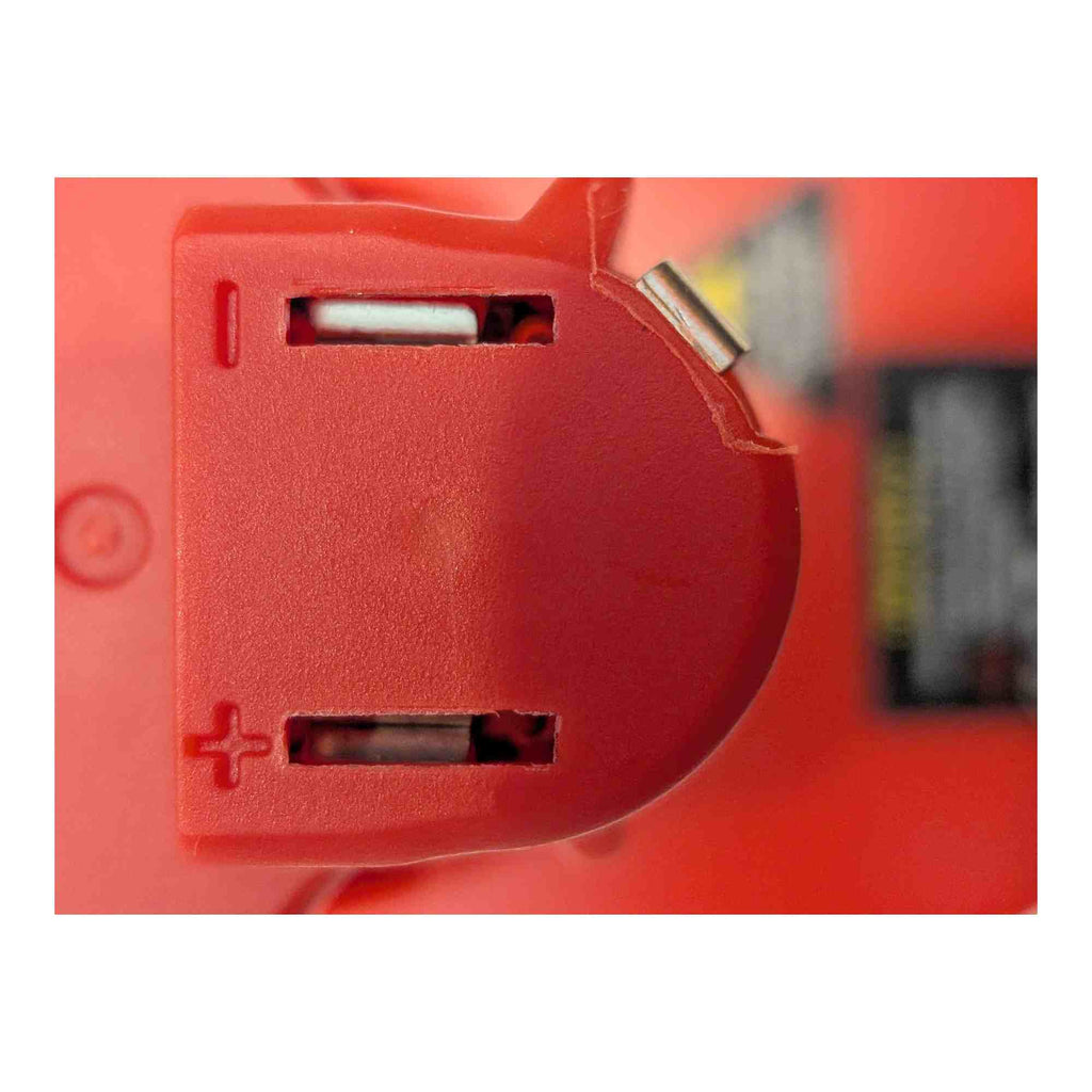Bauer 20V to Milwaukee M12 battery adapter - close-up of the two tool-side terminal slots marked plus and minus