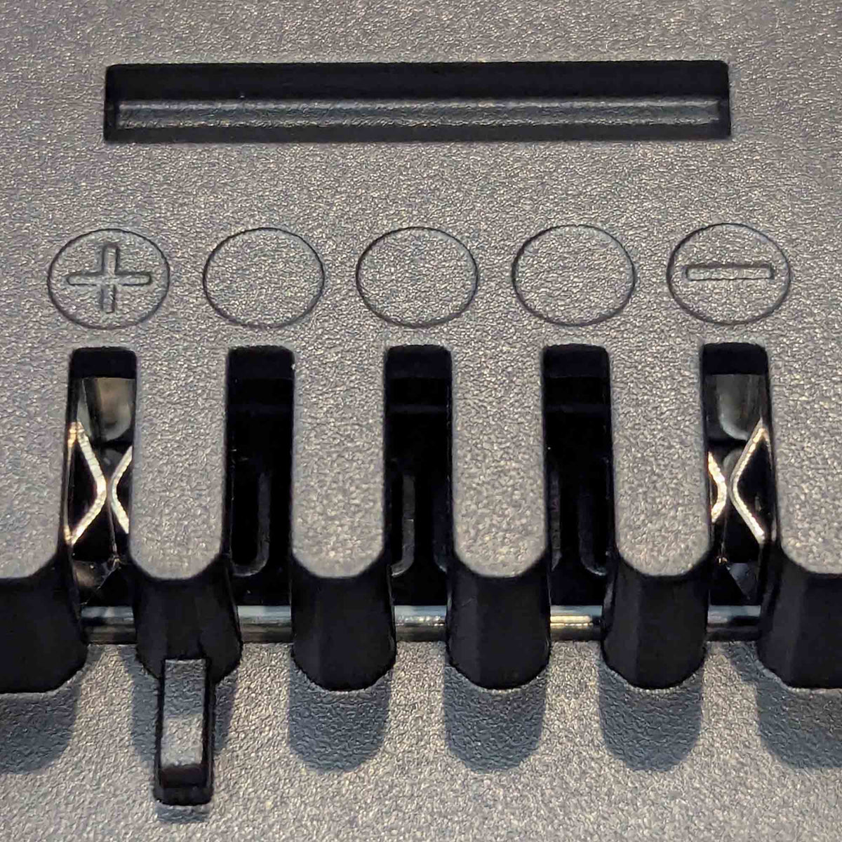 Makita 18V LXT to Einhell 18V PXC battery adapter - Einhell tool-side terminal slots with plus and minus marks